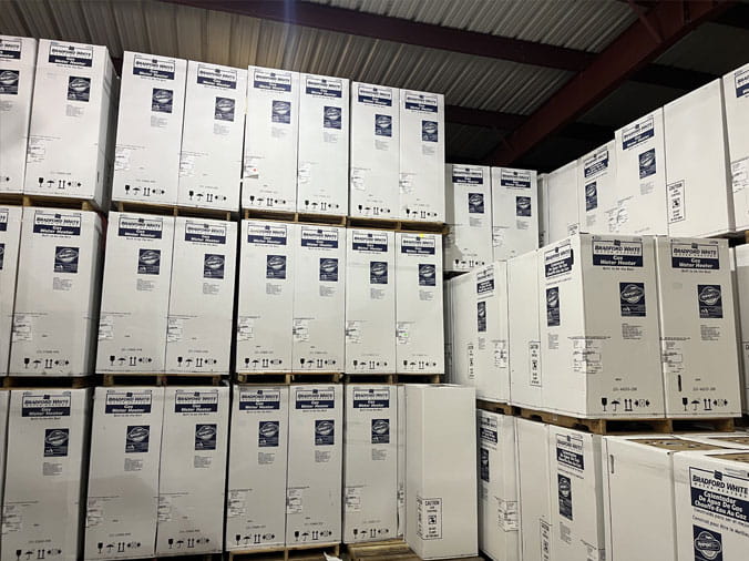 Water heaters stacked in the Moore Supply Memorial City PLumbing Warehouse